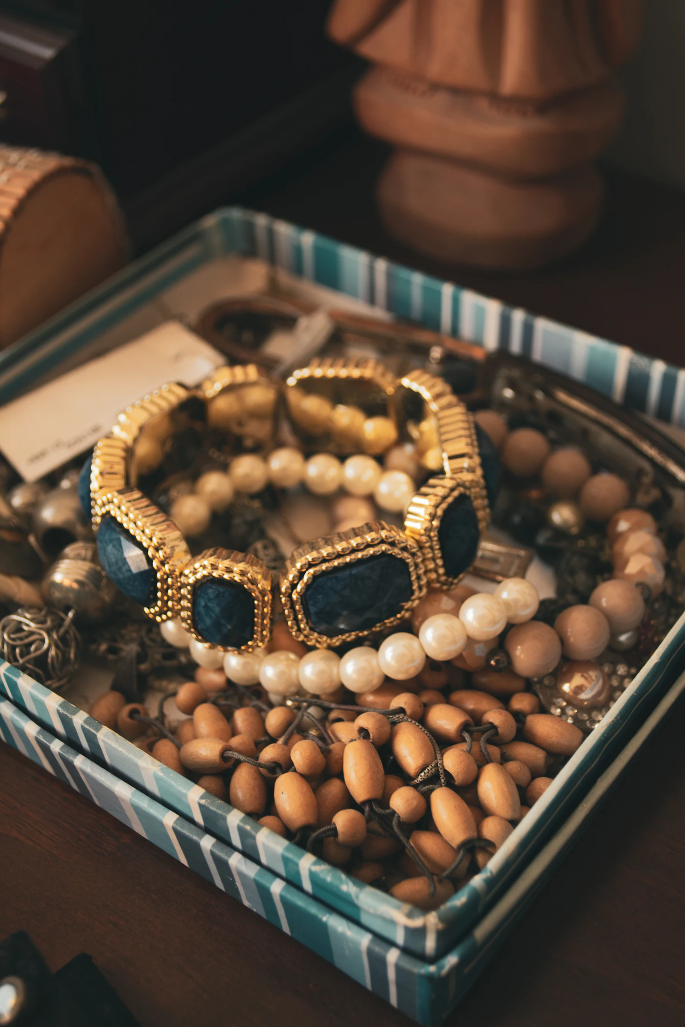 Beaded jewellery and bracelets gathered in a transparent box